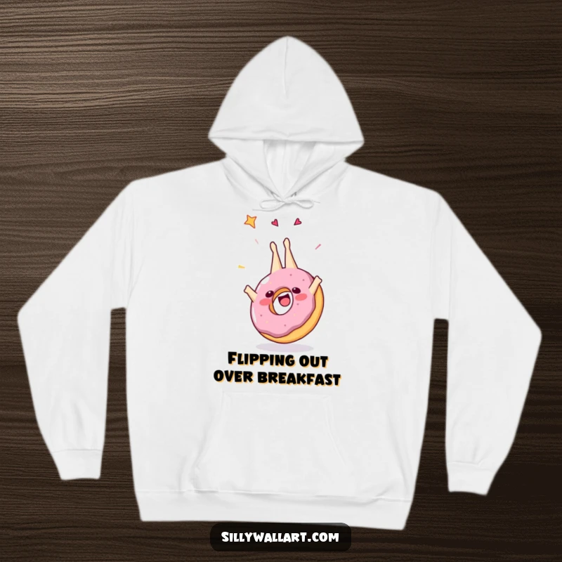 Funny hoodie featuring a joyful donut in a mid-air somersault, adorned with sprinkles, perfect for cozying up with a touch of sweet humor.