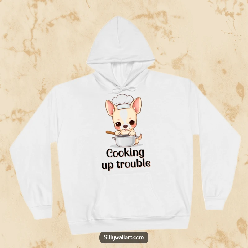 Funny hoodie showing a chihuahua in a chef hat, stirring a miniature pot. Cozy and culinary-themed for dog enthusiasts.