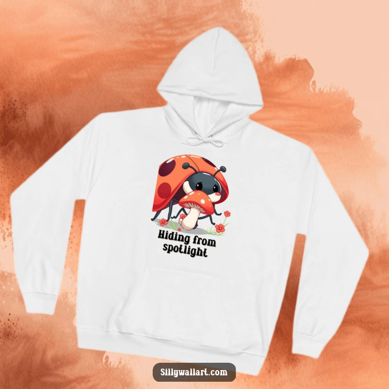 Funny shy mushroom hoodie with a mushroom peeking from behind a giant, laughing ladybug, perfect for cozy forest vibes.