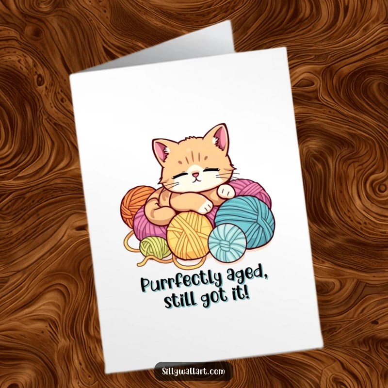 Funny Free Printable Birthday Card: Adorable cat lounging soundly on a huge pile of colorful yarn balls, pure relaxation.
