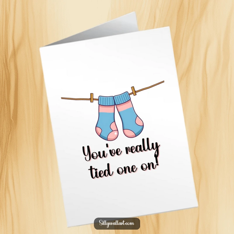 Funny free printable congratulations card showing a pair of socks tangled on a clothesline, humorously acting like a kite.