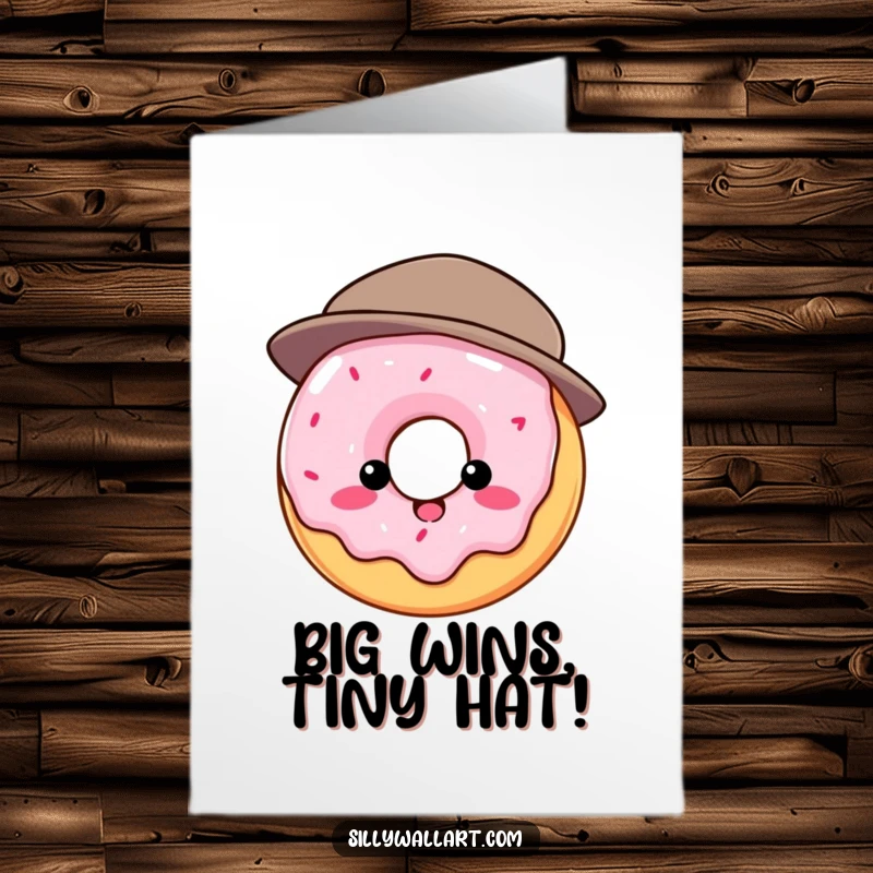 Funny free printable congratulations card featuring a donut humorously attempting to wear a hat that is much too small for its round shape.