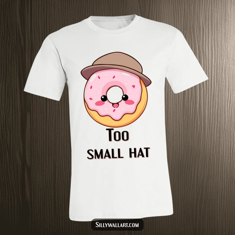 Funny t-shirt: Round donut comically attempting to wear a hat that is much too small, conveying struggle and humor.