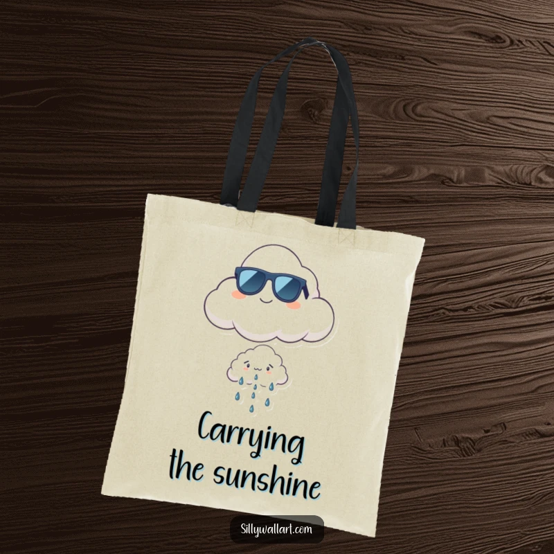 Funny cool cloud tote bag showcasing a proud cloud in sunglasses floating above a tiny, worried rain cloud, stylishly humorous.