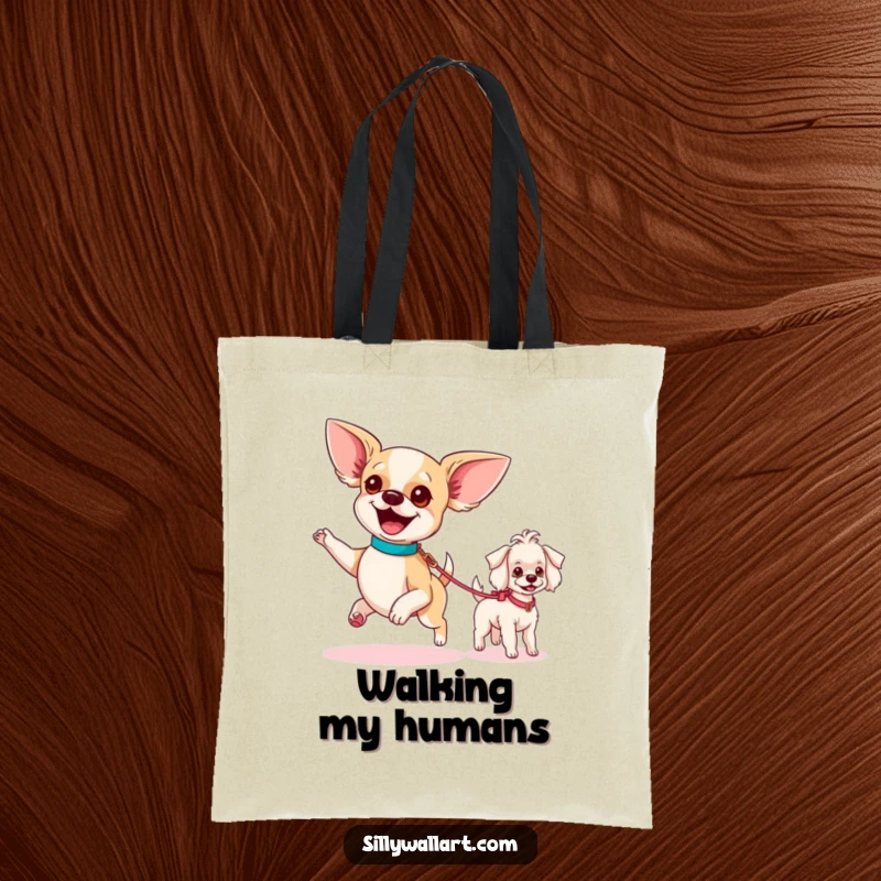 Funny tote bag featuring an excited chihuahua parading a tiny poodle on a leash, ideal for carrying essentials with doggy flair.